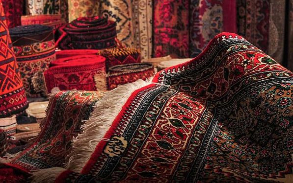 handmade-rugs-exporter-India-1-597x374